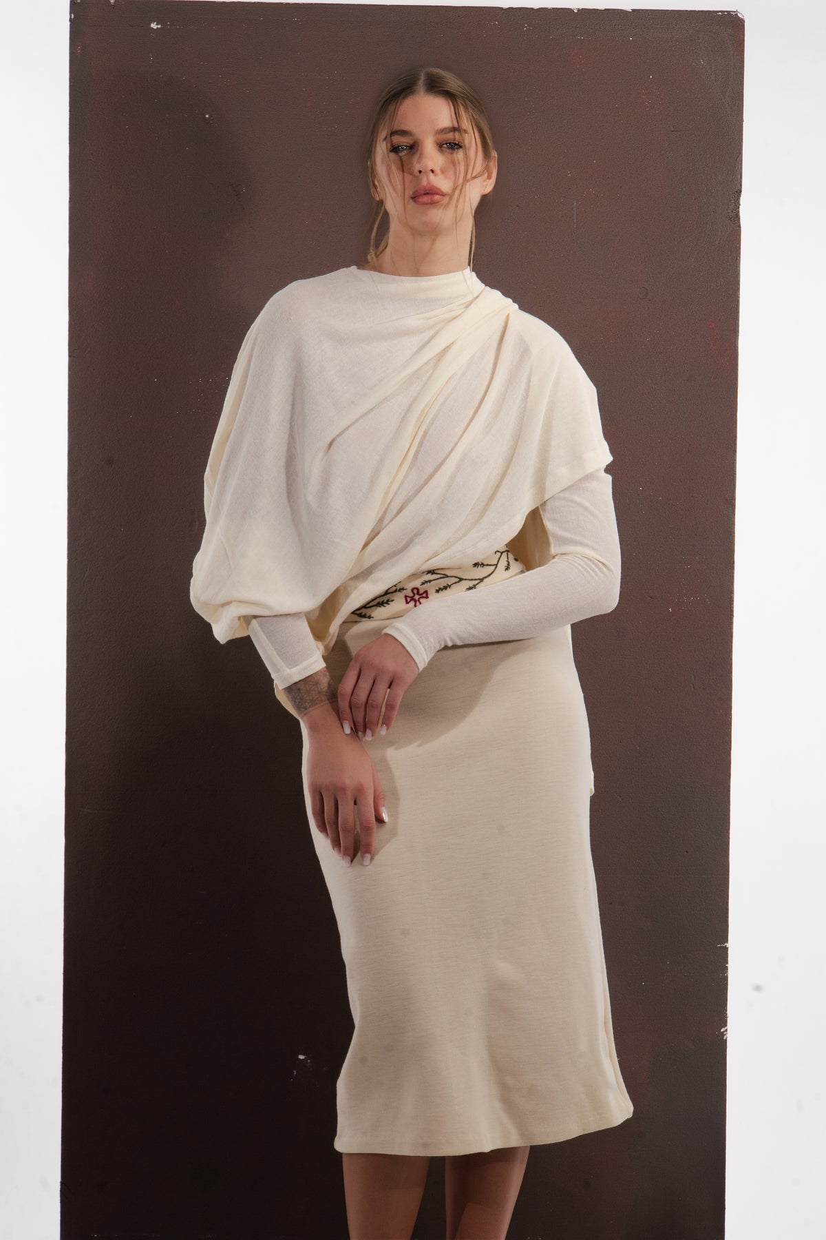 ALISADUDAJ ivory wool draped top and embroidered midi skirt, half-length view showing draped cowl and embroidered waistband