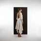 ALISADUDAJ ivory wool open-back drape dress, back three-quarter view showing deep open back