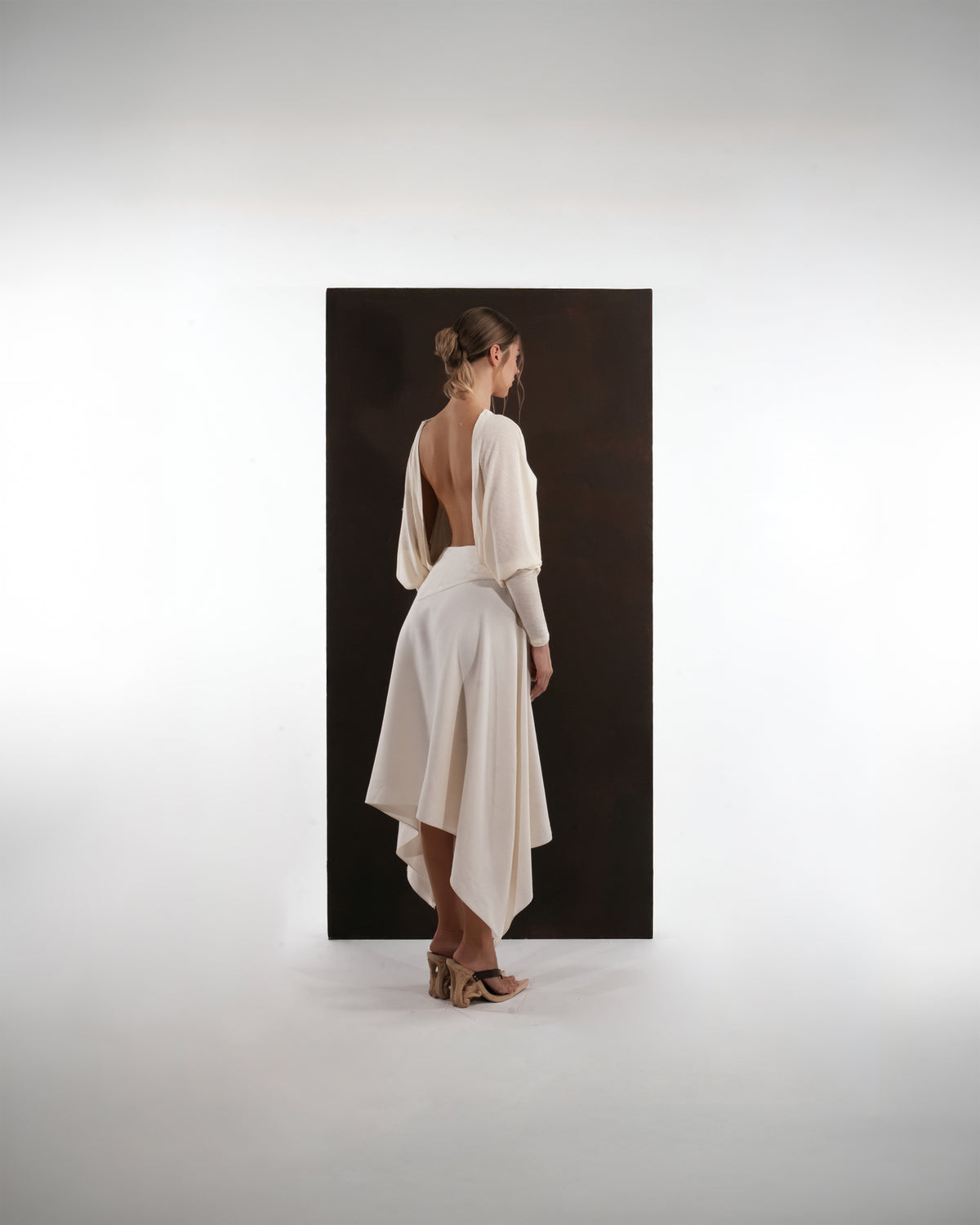 ALISADUDAJ ivory wool open-back drape dress, back three-quarter view showing deep open back