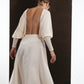 ALISADUDAJ ivory wool open-back drape dress, back view showing scooped open back and draped sleeves
