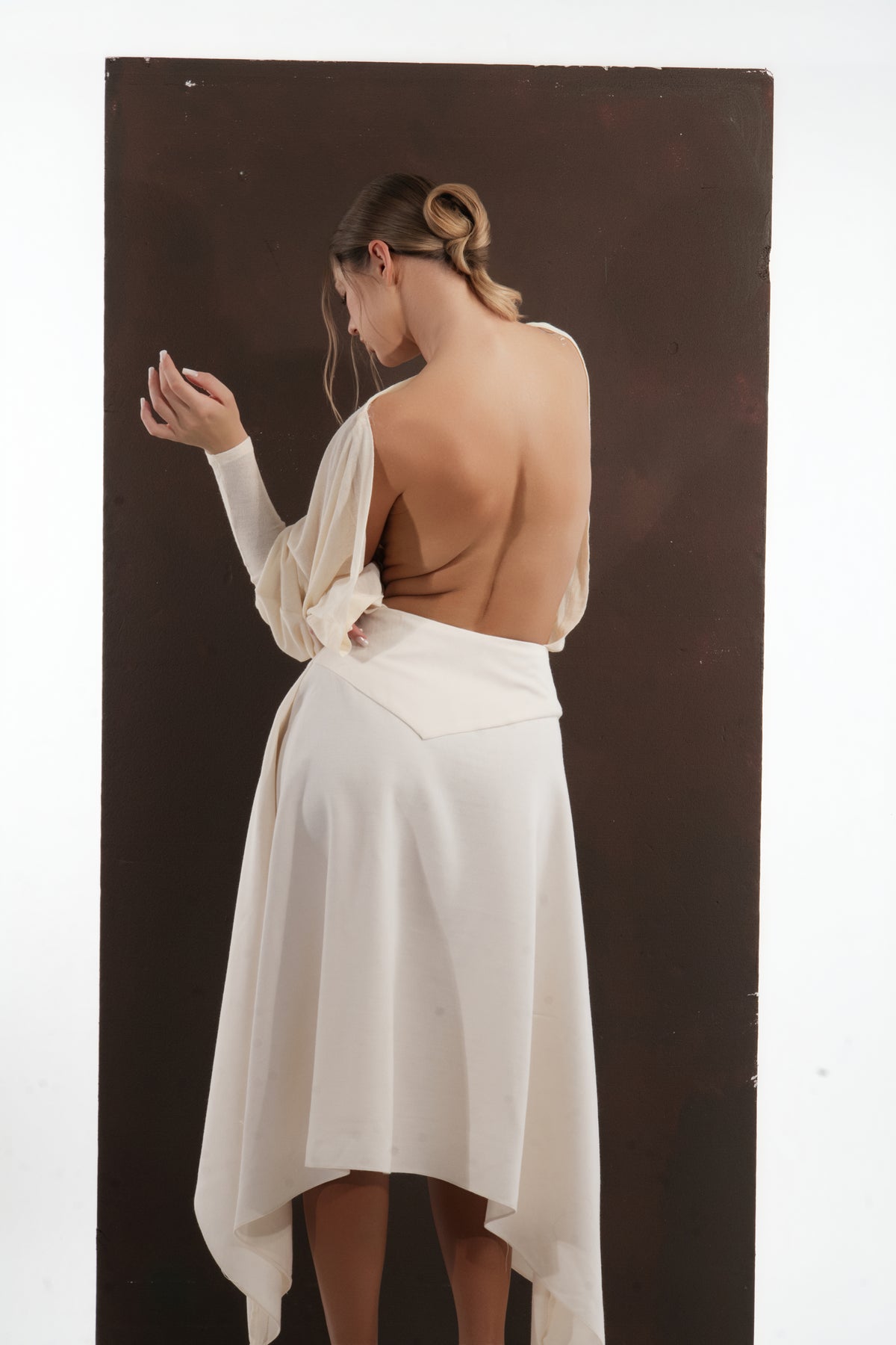 ALISADUDAJ ivory wool open-back drape dress, back close-up of draped shoulders and open back, wool blend