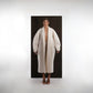 ALISADUDAJ ivory wool cocoon coat, front view showing rounded sleeve volume and wide shawl lapels