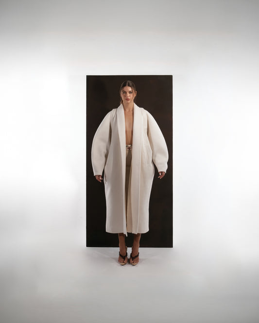 ALISADUDAJ ivory wool cocoon coat, front view showing rounded sleeve volume and wide shawl lapels