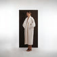 ALISADUDAJ ivory wool cocoon coat, side three-quarter view showing shawl collar and midi length
