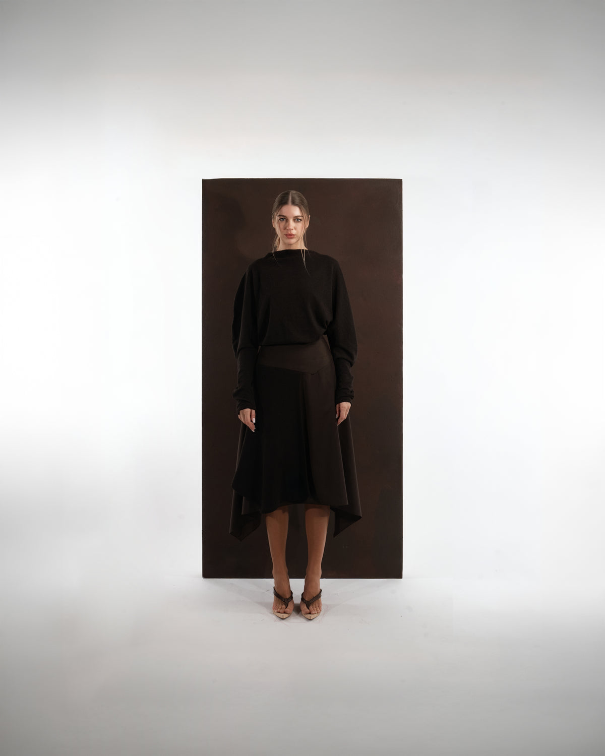 ALISADUDAJ mocha brown wool open-back dress, front view, full length, showing blouson bodice and handkerchief-hem skirt