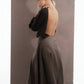 ALISADUDAJ mocha brown wool open-back dress, side back view showing sleeve drape and flared skirt, wool blend