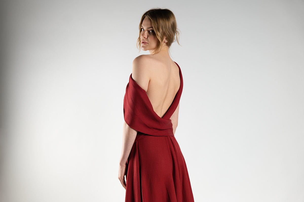 ALISADUDAJ red linen off-shoulder draped dress, back three-quarter view showing deep open back and drape