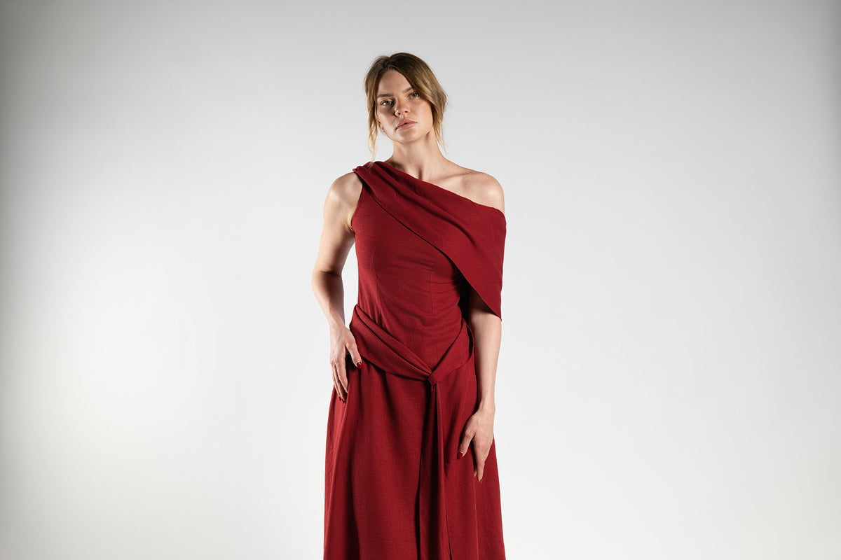 ALISADUDAJ red linen off-shoulder draped dress, half-length front view showing asymmetric drape across the bodice