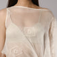 ALISADUDAJ sheer mesh overlay top, close-up of boat neckline and white geometric embroidery