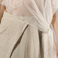 ALISADUDAJ taupe linen set, close-up of wrap waist button and sheer mesh over linen