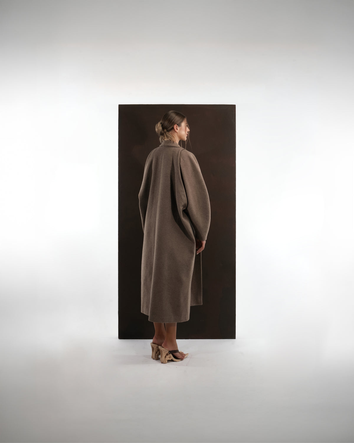 ALISADUDAJ taupe wool oversized coat, back view showing cocoon silhouette and rounded sleeves