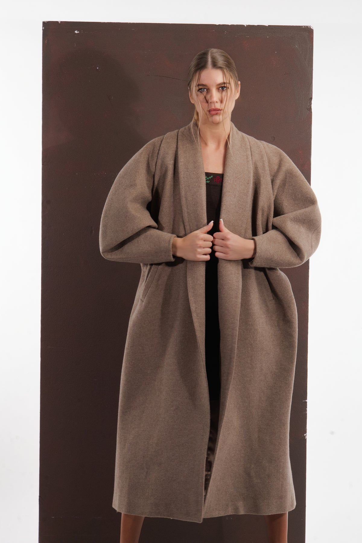 ALISADUDAJ taupe wool oversized coat, front close-up of shawl collar held in both hands, wool blend