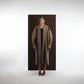 ALISADUDAJ taupe wool shawl-collar oversized coat, front view, full length, worn open over a dark dress