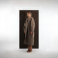ALISADUDAJ taupe wool oversized coat, side three-quarter view showing shawl collar and midi length