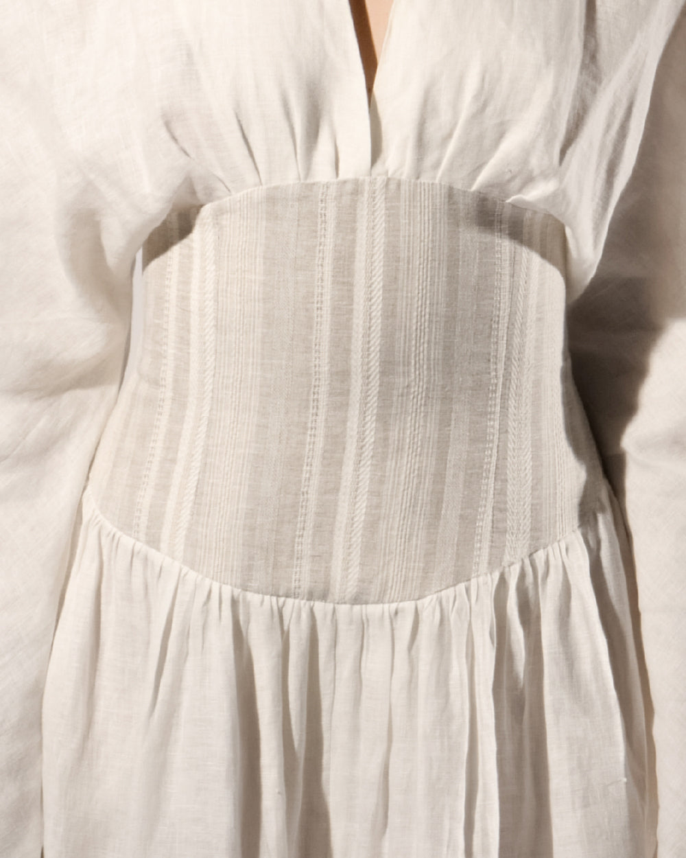 ALISADUDAJ white linen corseted maxi dress, close-up of striped woven corset panel and gathered skirt