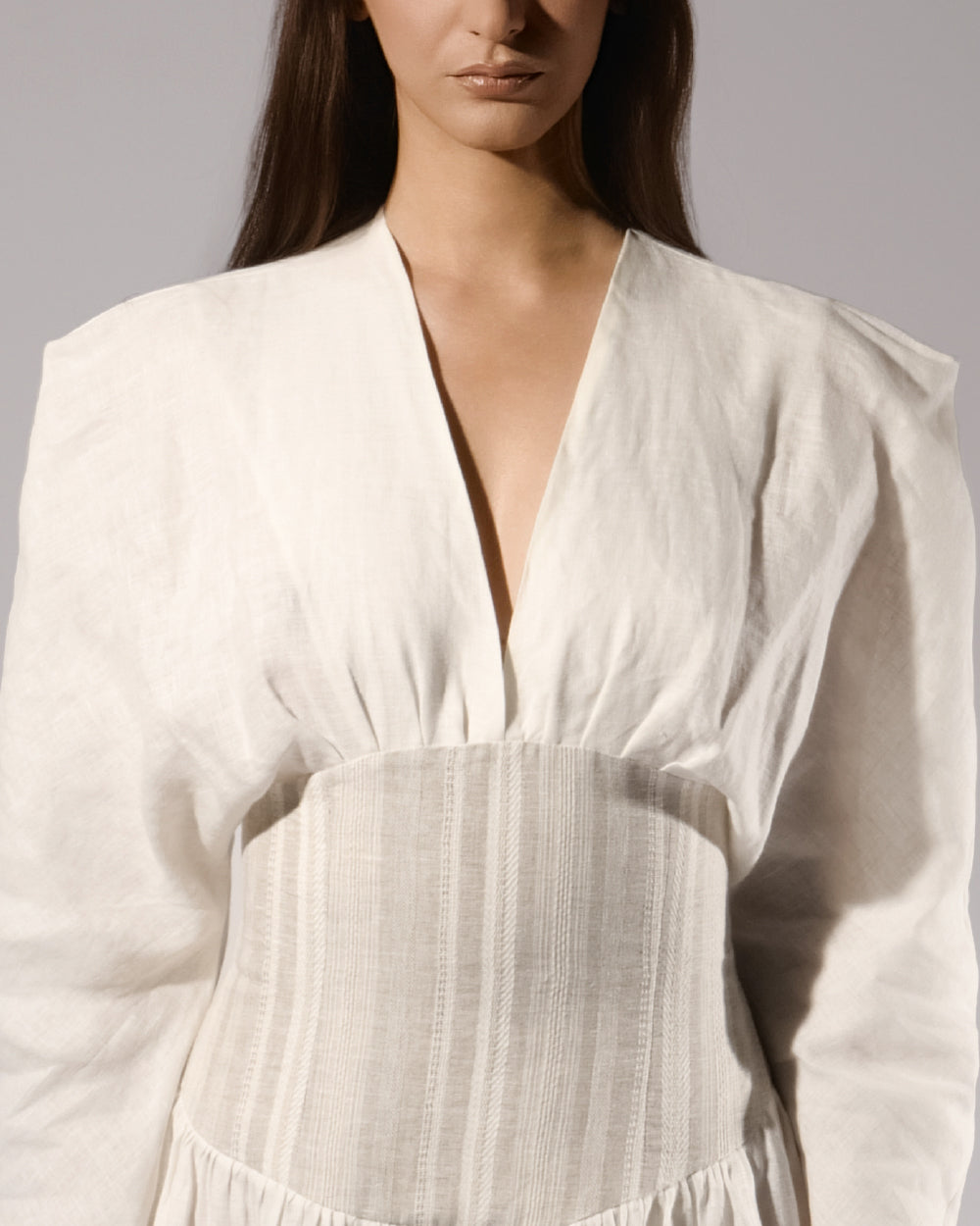 ALISADUDAJ white linen corseted maxi dress, front close-up of deep V neckline and gathered bodice