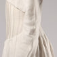 ALISADUDAJ white linen corseted maxi dress, side close-up of sleeve seam and skirt gathers, linen