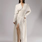ALISADUDAJ white linen corseted maxi dress, front three-quarter view with hand on hip showing high leg slit