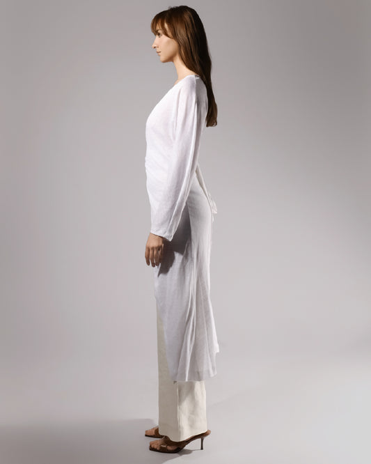 ALISADUDAJ white linen draped set, side profile showing long tunic split and wide-leg trousers