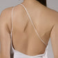 ALISADUDAJ white linen strappy maxi dress, back close-up of thin crossed straps and open back