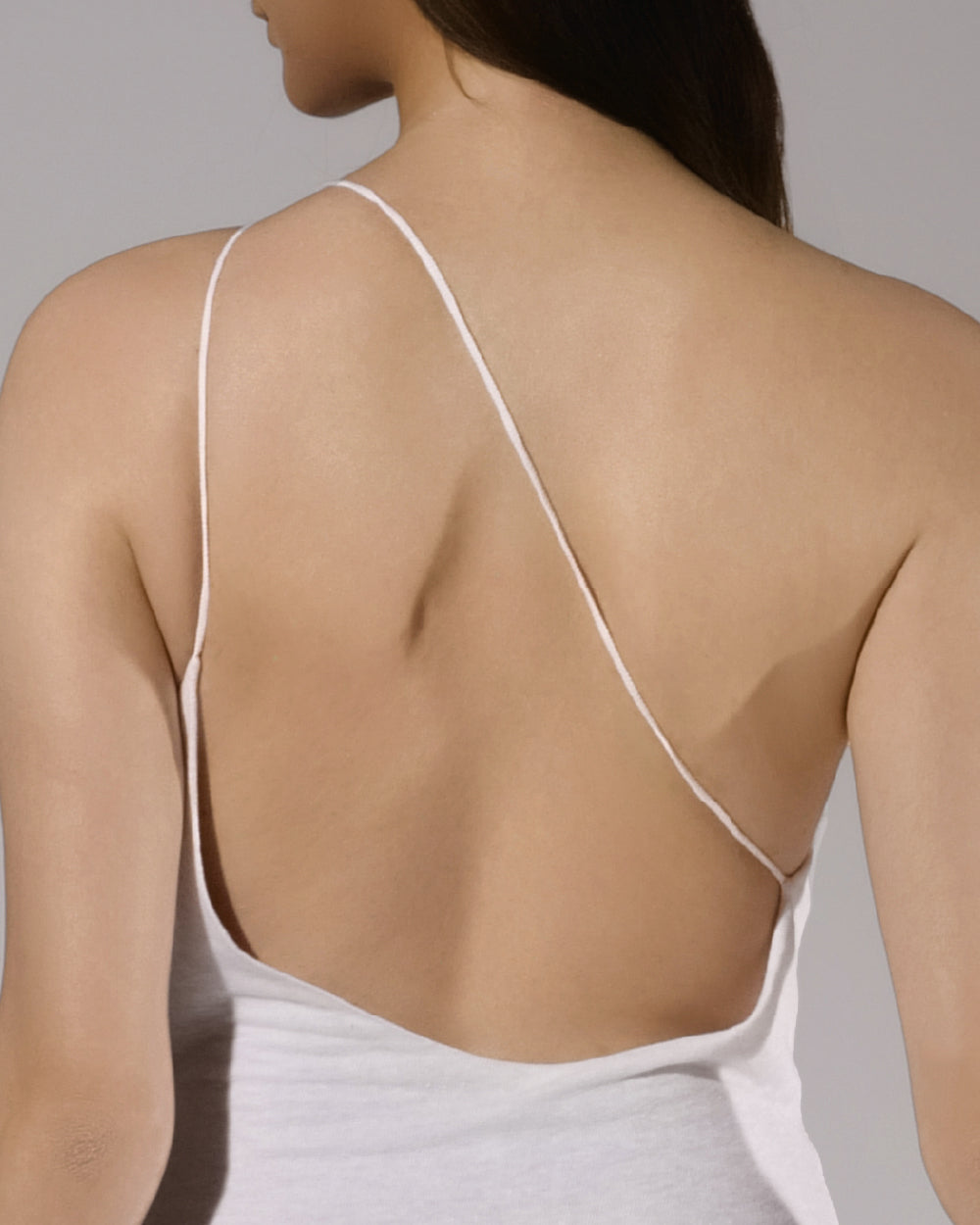 ALISADUDAJ white linen strappy maxi dress, back close-up of thin crossed straps and open back