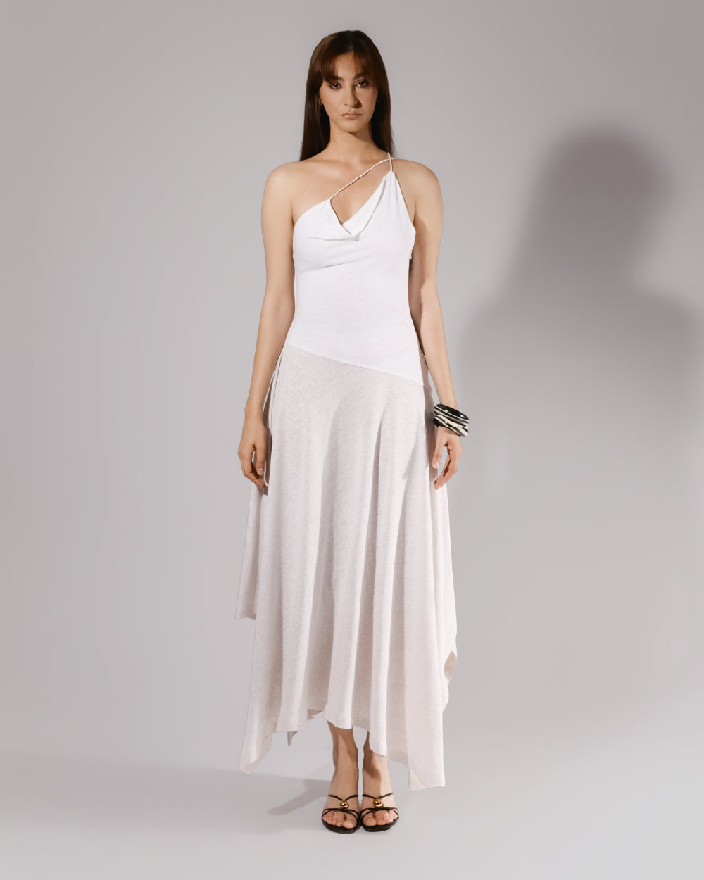 ALISADUDAJ white linen strappy maxi dress, front view, full length, showing asymmetric cowl neckline and handkerchief hem