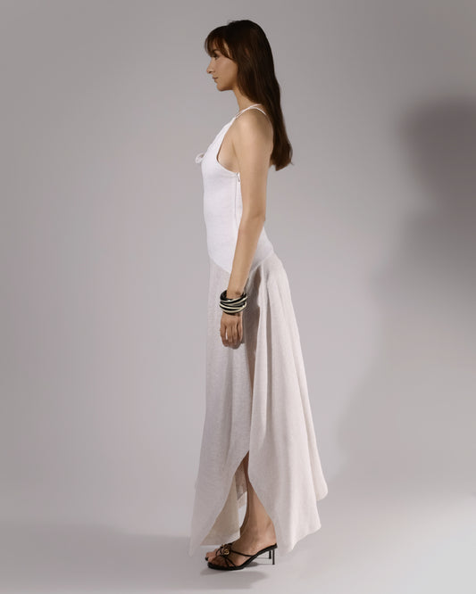 ALISADUDAJ white linen strappy maxi dress, side profile showing fitted bodice and flared skirt