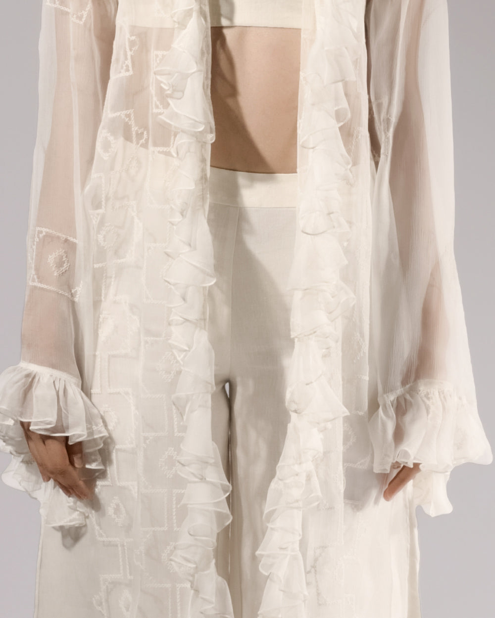 ALISADUDAJ white sheer silk three-piece set, half-length view showing ruffled cuffs and trouser waist