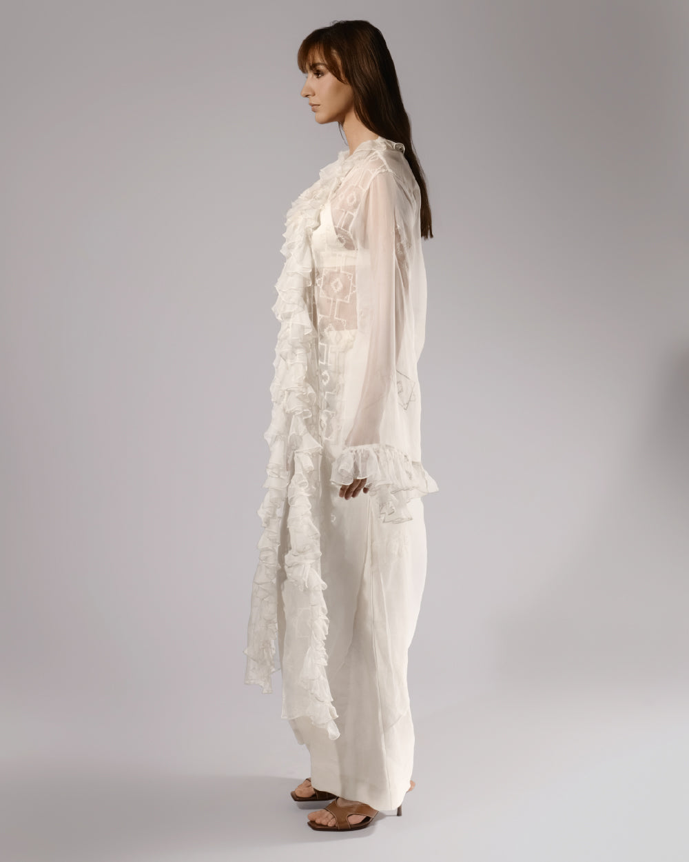 ALISADUDAJ white sheer silk three-piece set, side profile showing ruffled duster and wide-leg trousers